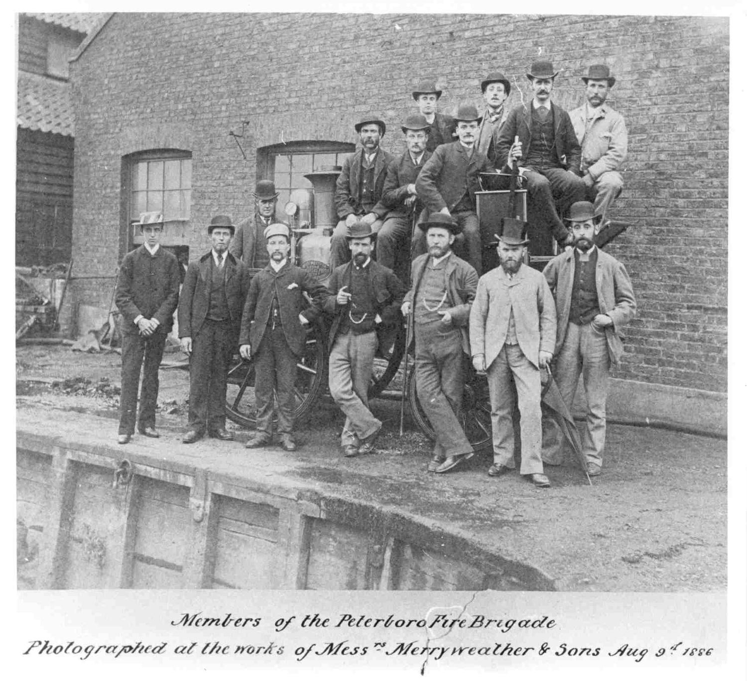 Peterborough Fire Brigade members stand with their new engine at the Merryweather & Sons works in London. 09.08.1886