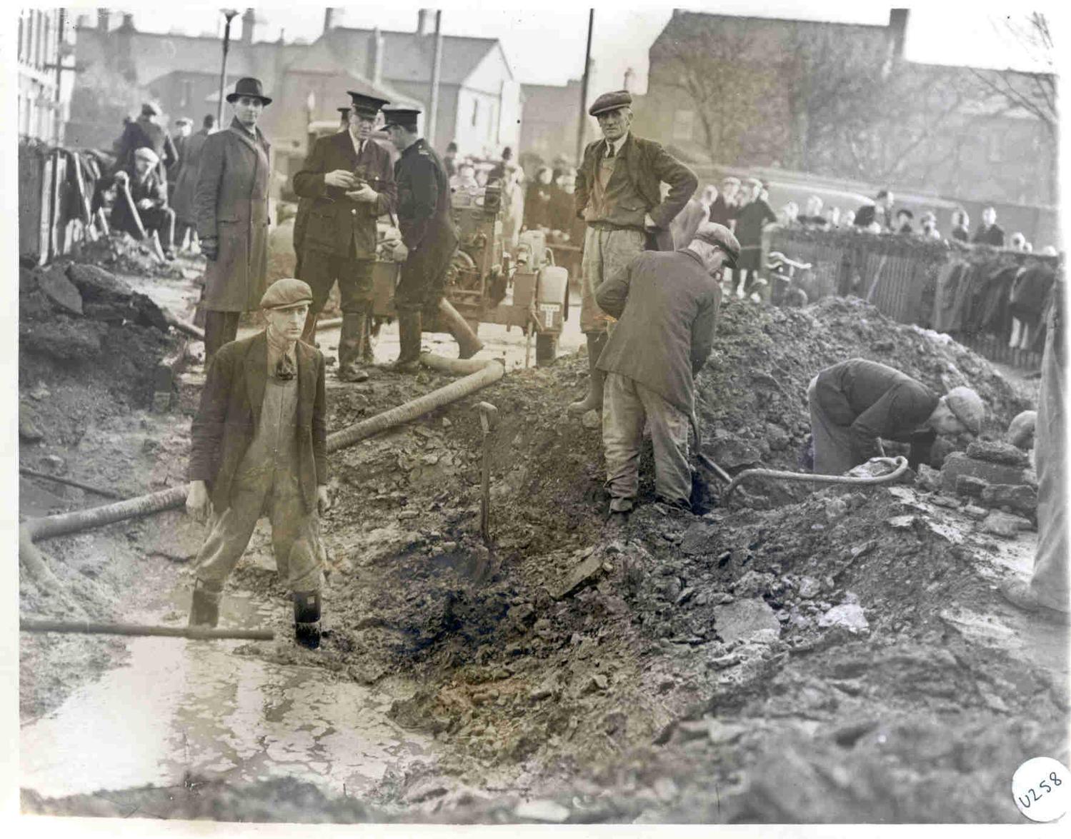 Repairing damaged services after an air raid in London Road, 1940.