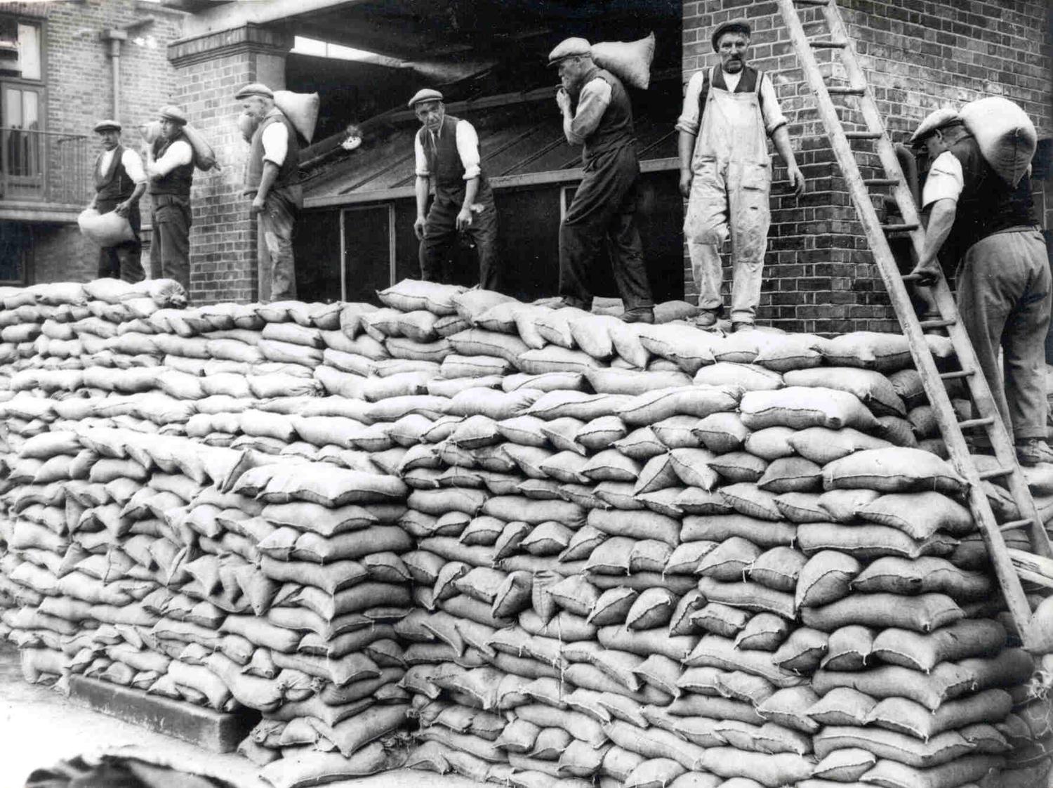 Team of men from the Air Raid Patrol (A.R.P.) sandbagging the entrance to the Thorpe Road Hospital operating theatre in the days after the outbreak of war in 1939.